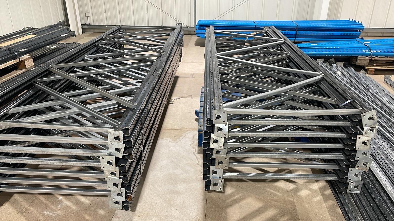 Pallet racking frames and beams stacked ready for installation