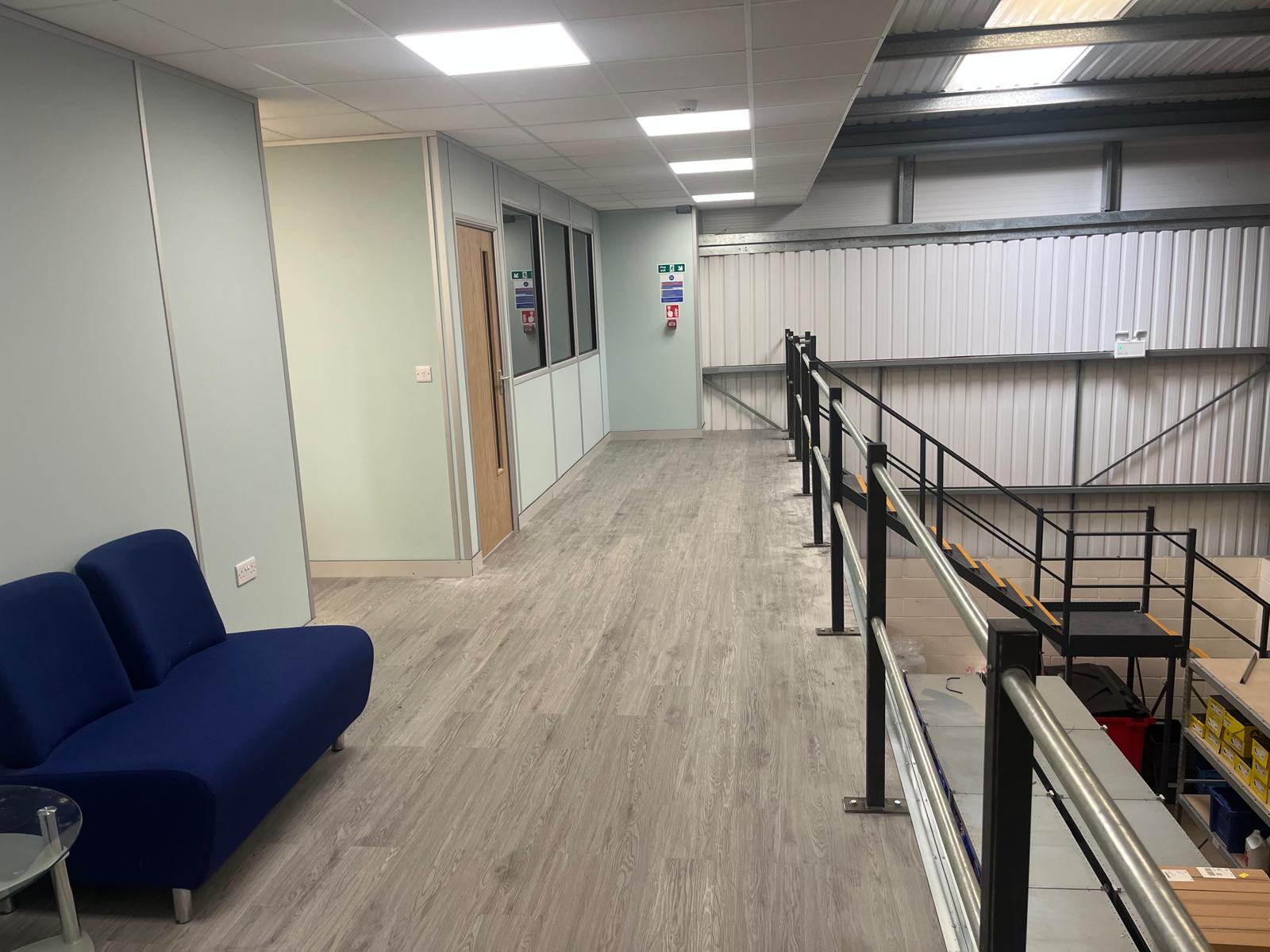 Completed first-floor office on a mezzanine with partitions and suspended ceiling